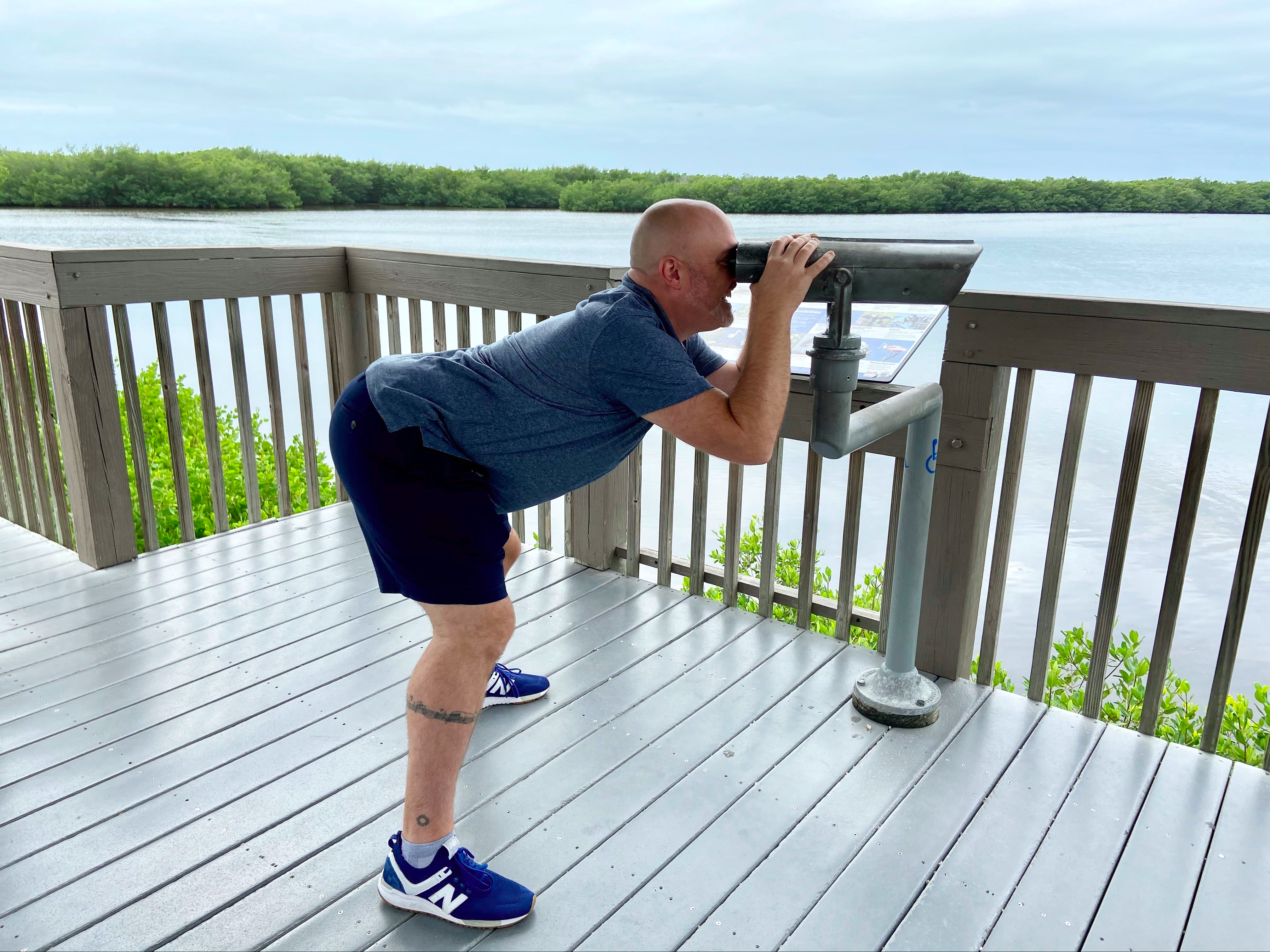Photo of Marlen standing at telescope