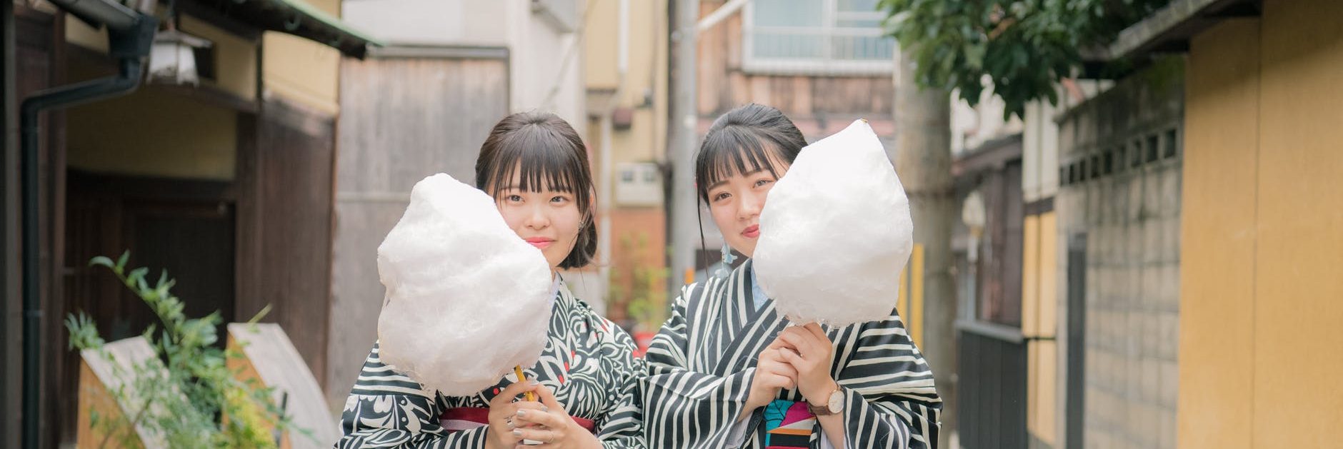 women in kimono holding cotton candy